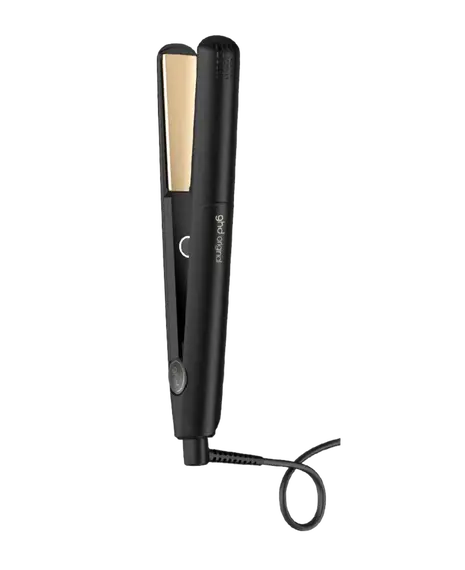Black hair straightener with gold accents on a white background