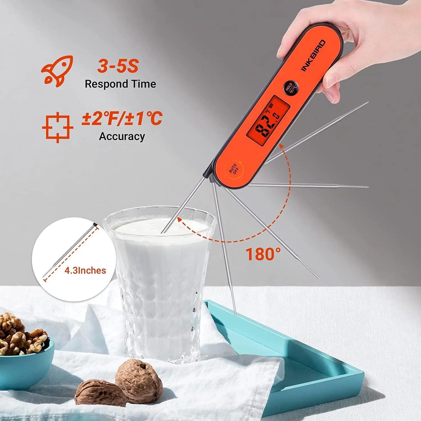 Digital thermometer being used to measure temperature of a glass of milk with product details displayed.