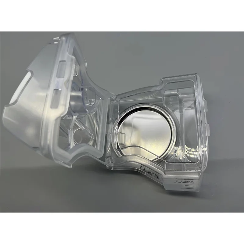 Clear plastic component on a gray background