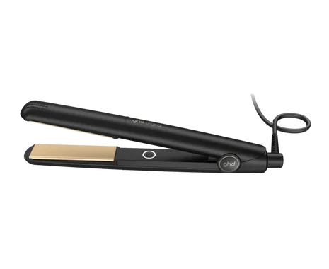 Black hair straightener with gold accents on a white background