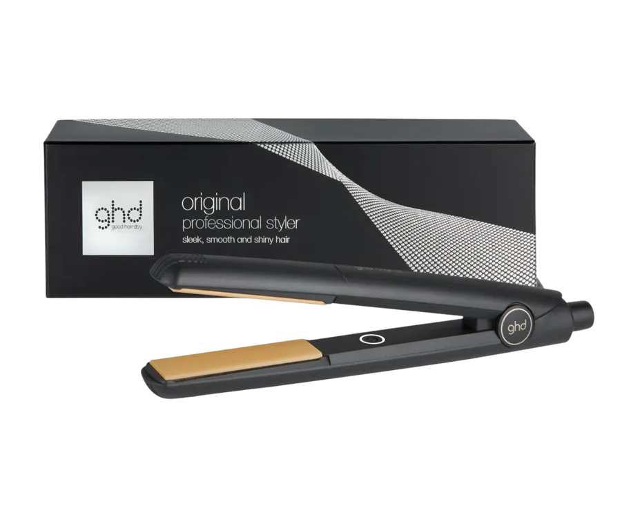 ghd hair straightener with packaging on a white background