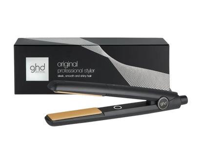 ghd hair straightener with packaging on a white background