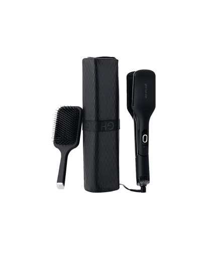 Black hair styling tool set with paddle brush and straightener on a white background