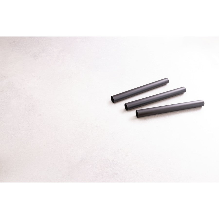 Three black cylindrical objects on a white background