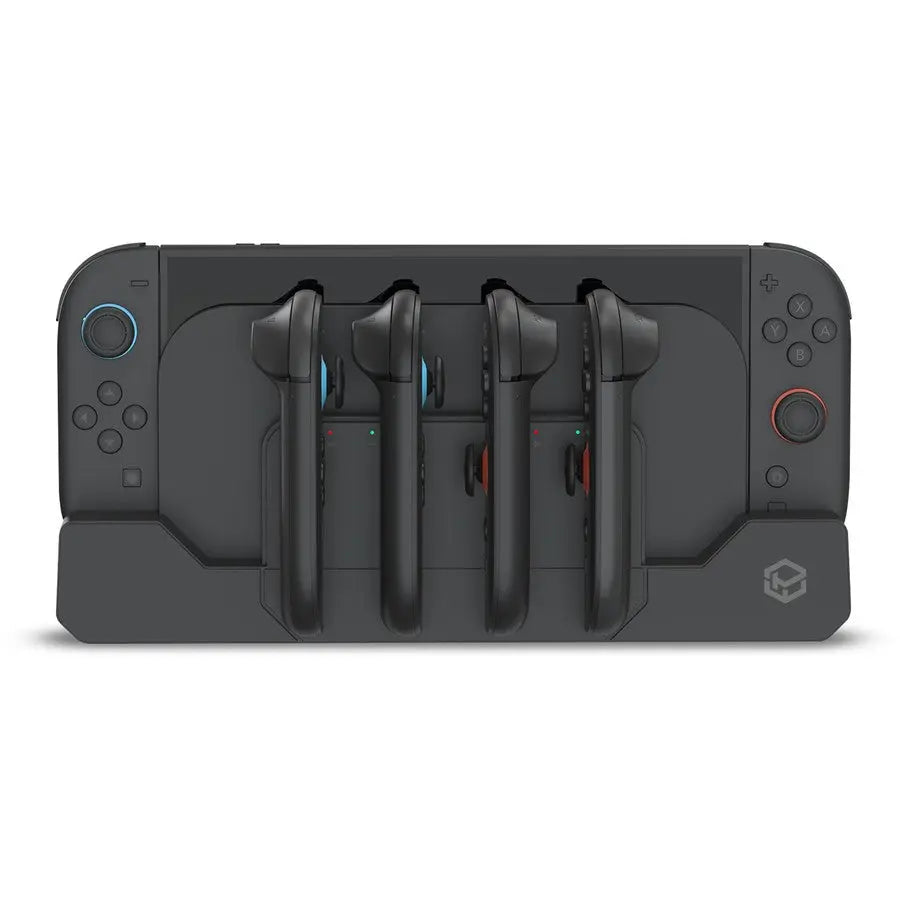 Gaming console with four controllers on a white background