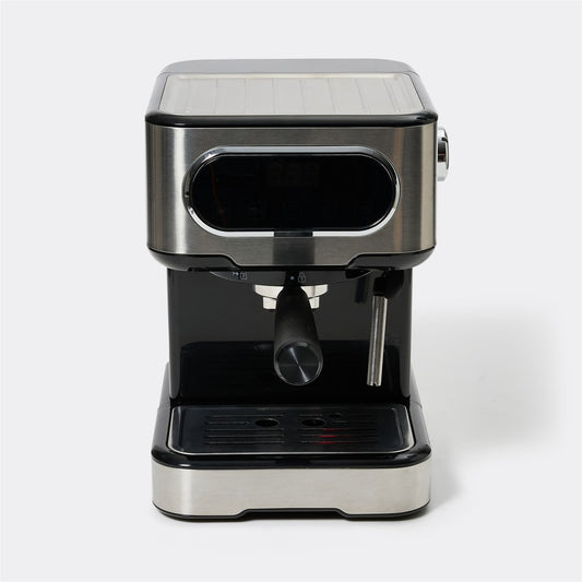A compact espresso machine with a brushed stainless steel body and black accents, featuring a portafilter and steam wand, photographed on a light gray background.
