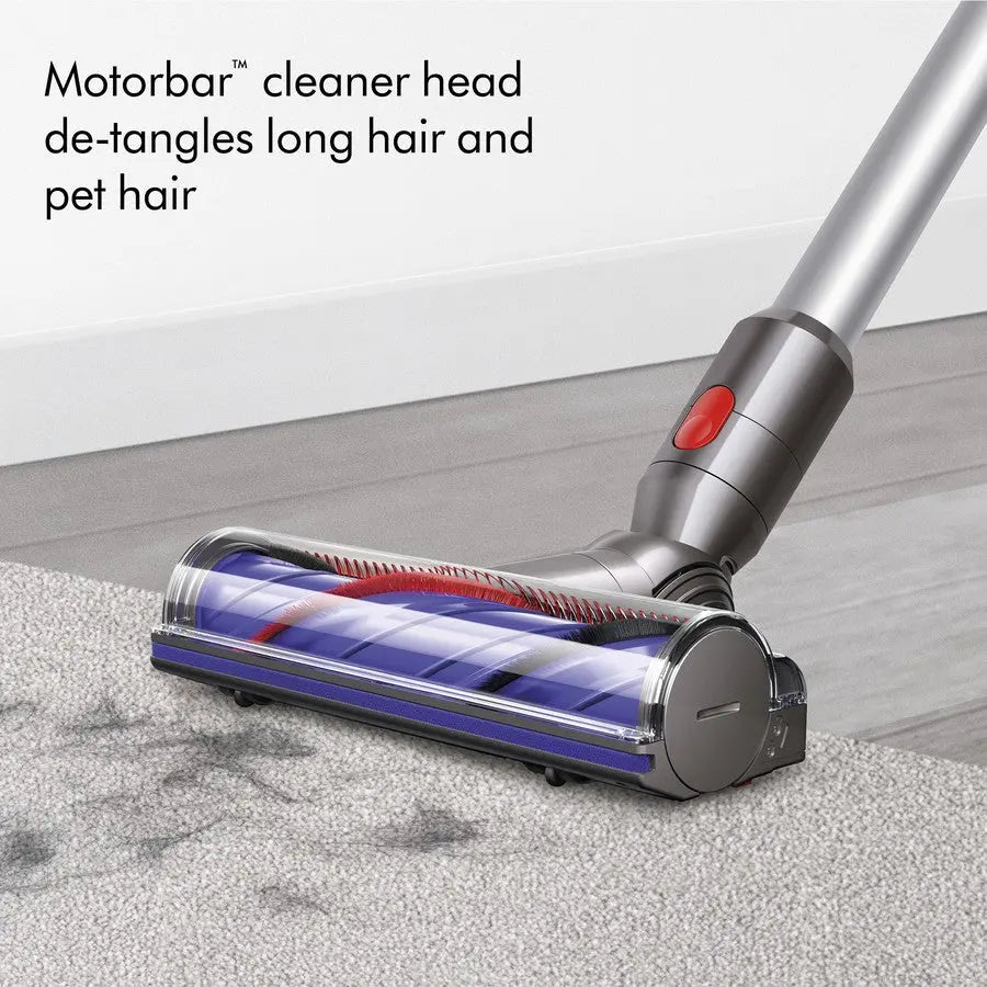Dyson vacuum cleaner head with Motorbar technology on a carpeted floor.
