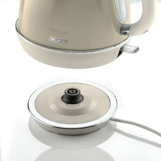Beige electric kettle with a matching base on a white background