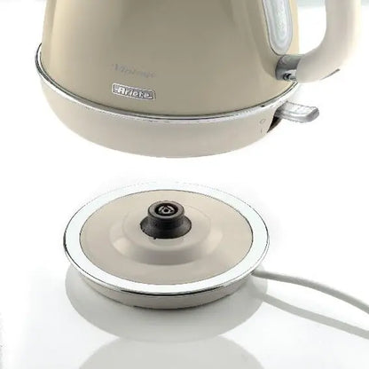 Beige electric kettle with a matching base on a white background