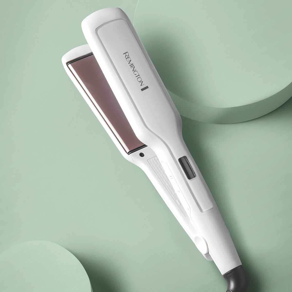 Remington Pro Ceramic hair straightener held in hand
