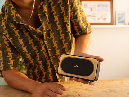 Marley Roots Solar speaker held indoors
