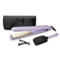 Purple hair straightener with accessories on a white background