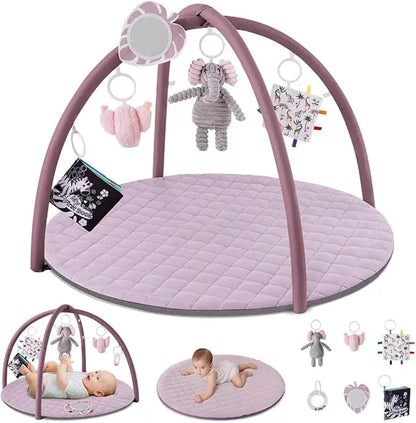 Baby play gym with toys and a baby lying on a mat