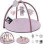 Baby play gym with toys and a baby lying on a mat