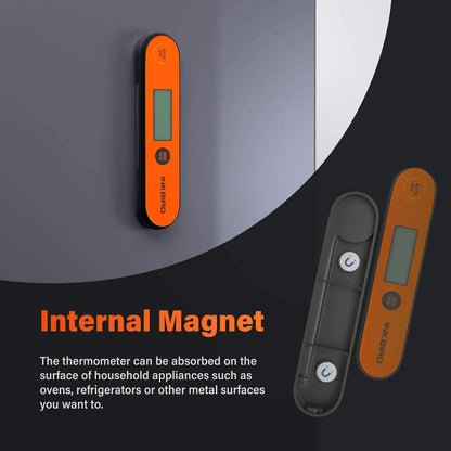 Orange digital thermometer with black base on a gray background, featuring text about an internal magnet.
