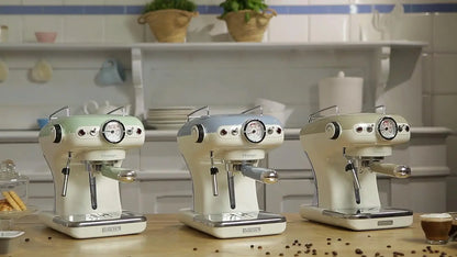 Three vintage-style espresso machines on a kitchen counter with a tiled wall background.