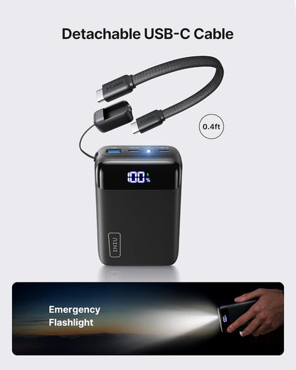 Black power bank with digital display and detachable USB-C cable, featuring an emergency flashlight function.