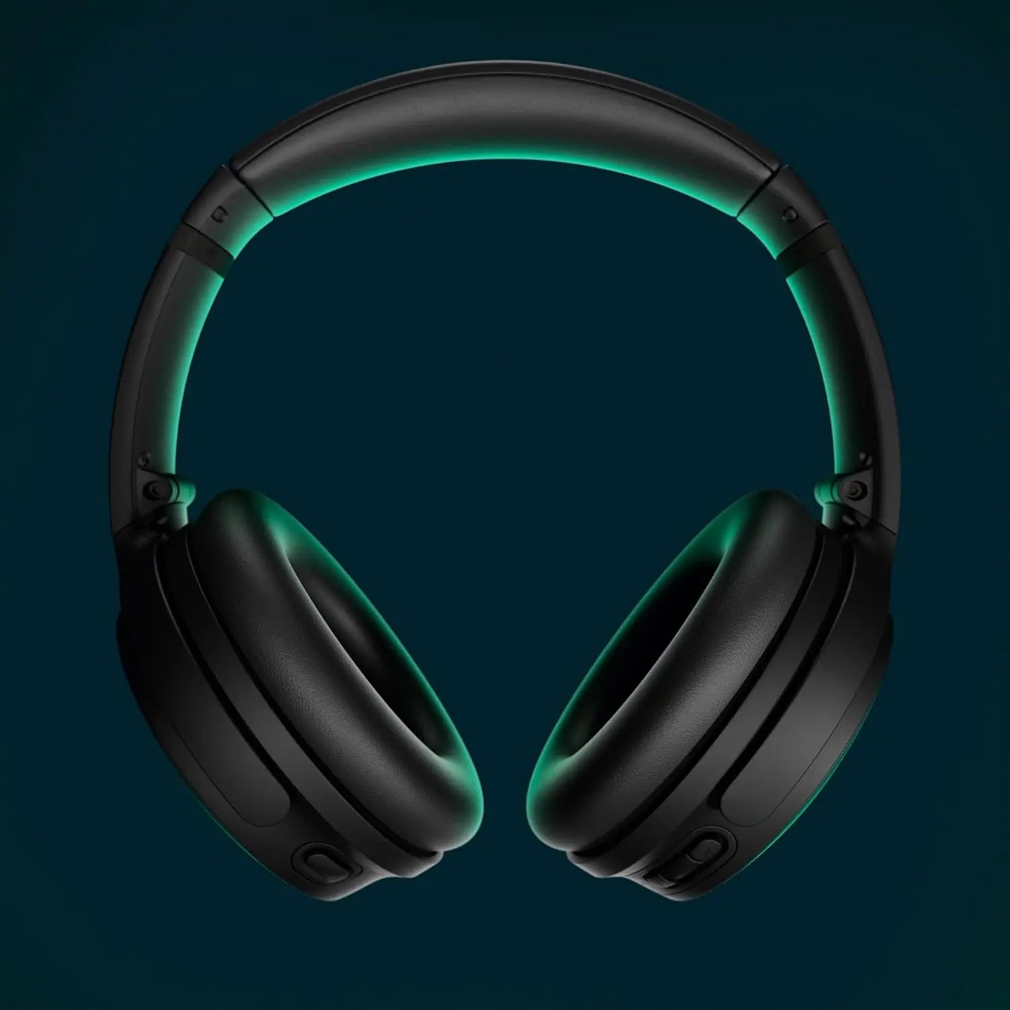 Black headphones with green lighting on a dark background