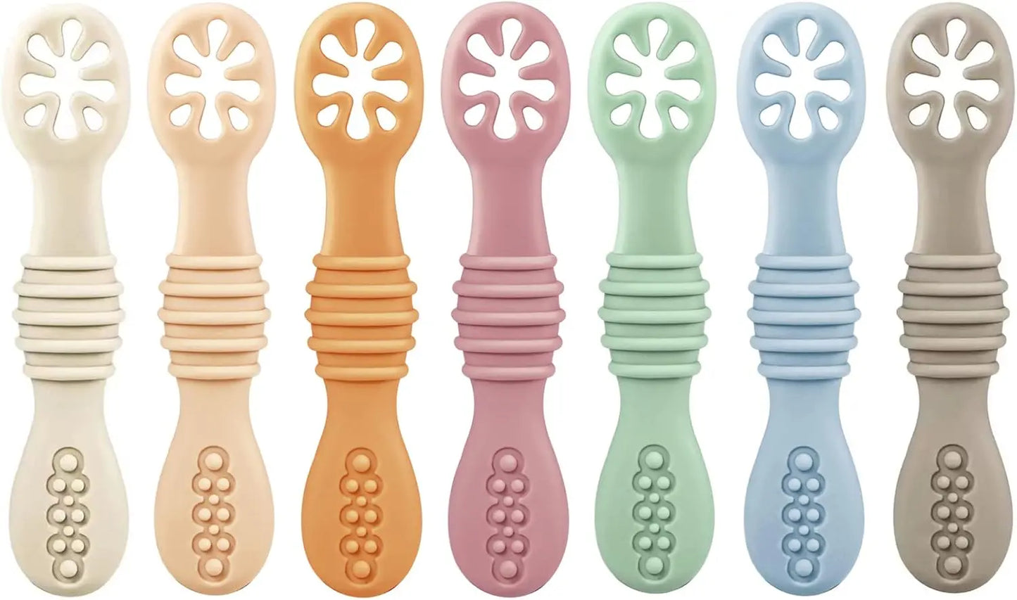 Set of eight colorful baby teething toys with various designs.