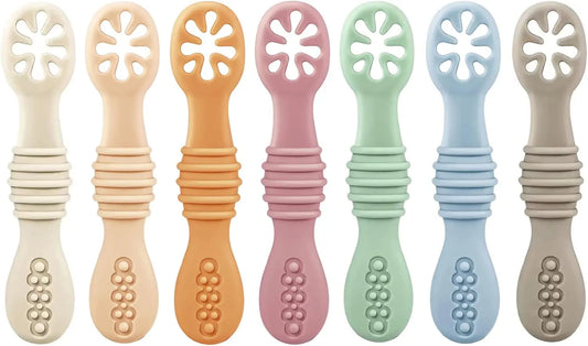 Set of eight colorful baby teething toys with various designs.
