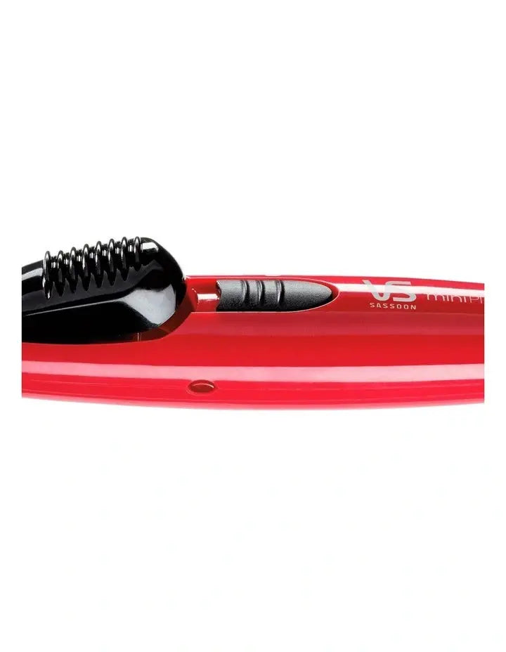 VS Sassoon Red hair straightener with black handle on a white background
