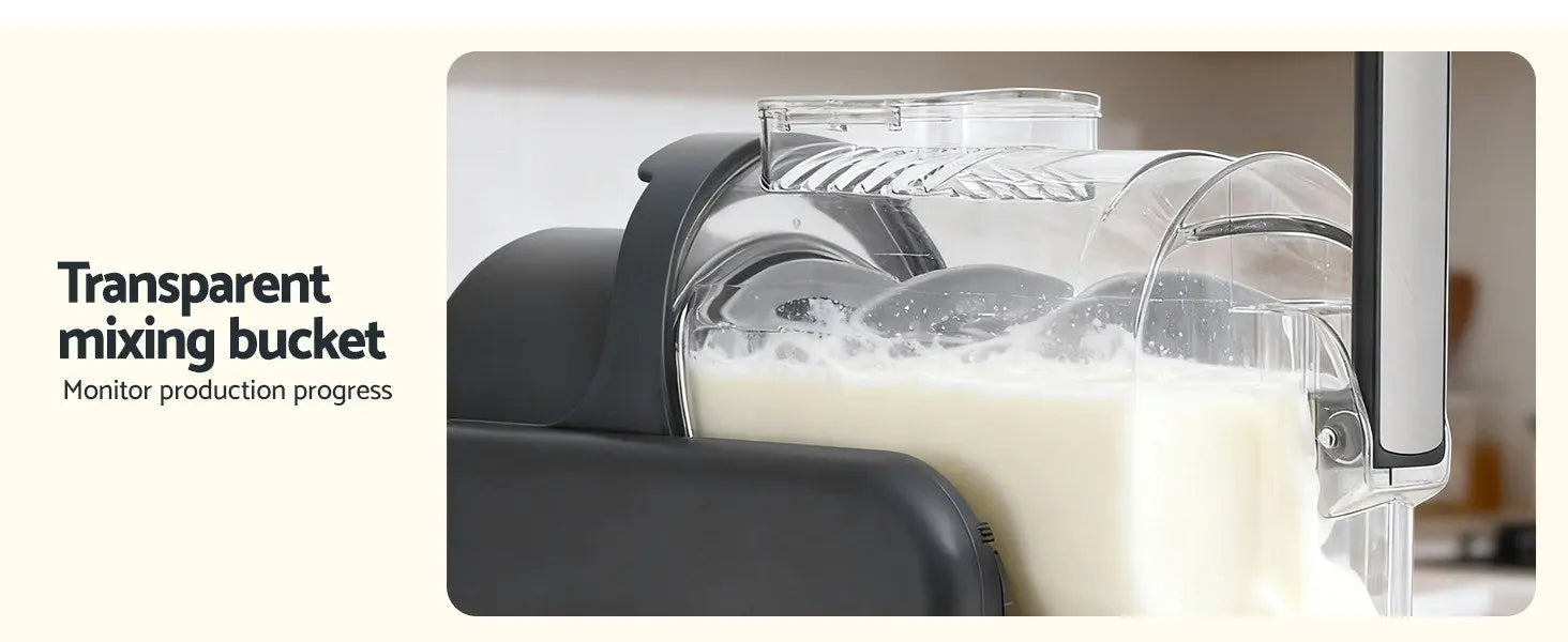 Transparent mixing bucket in a kitchen setting with milk being poured.