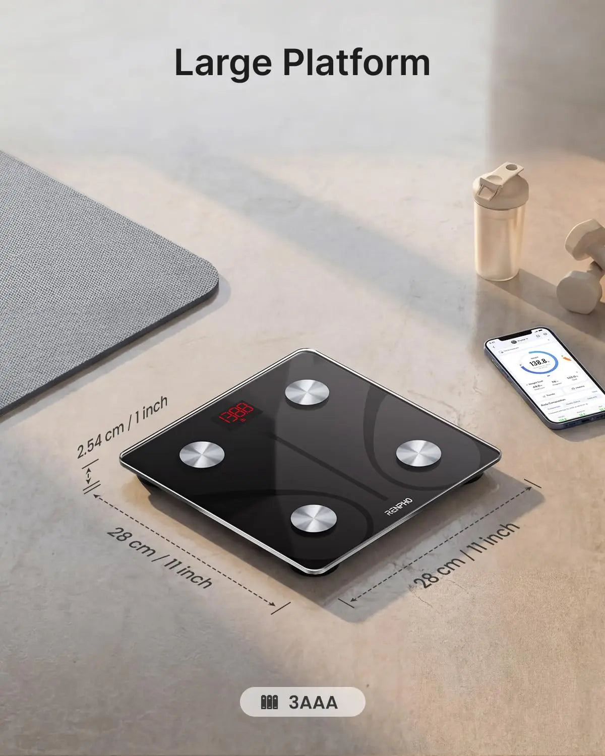 Black digital scale on a light surface with dimensions and battery information displayed.