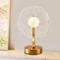 Decorative table lamp with floral design on a neutral background