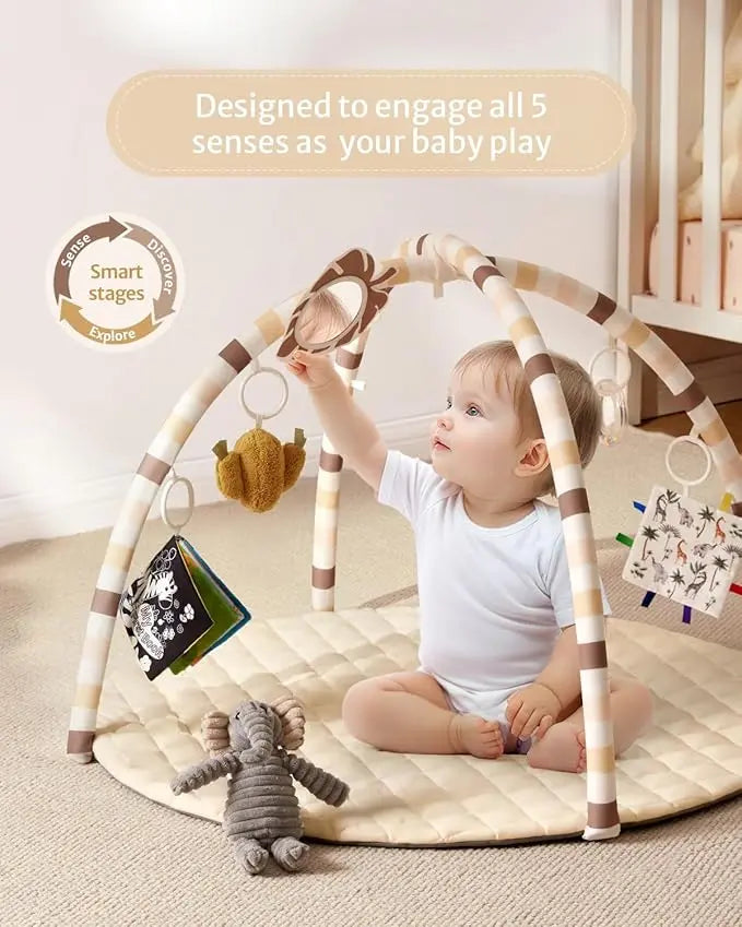 Baby playing with a activity gym on a carpeted floor.