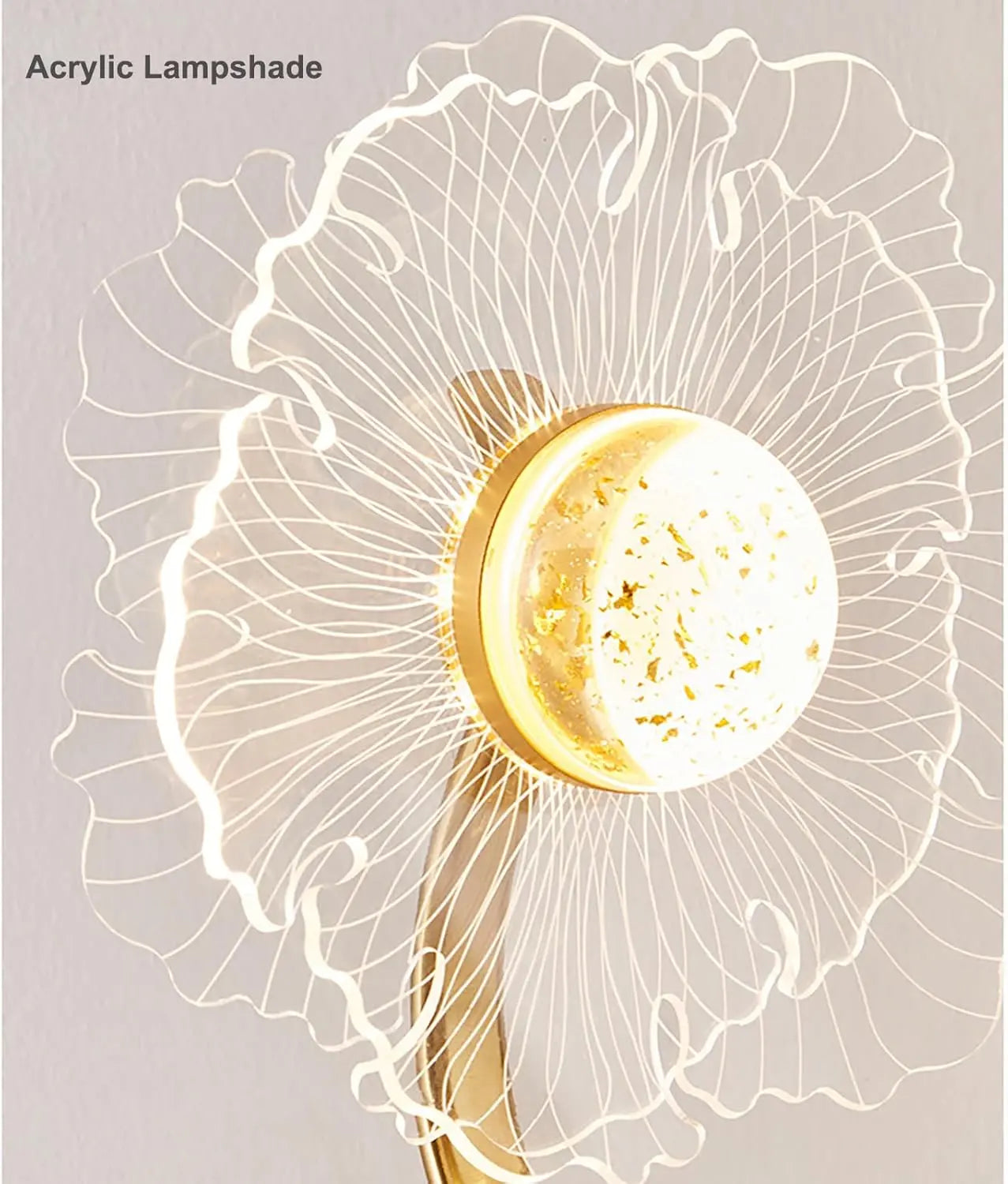 Acrylic lampshade with a gold base on a light gray background