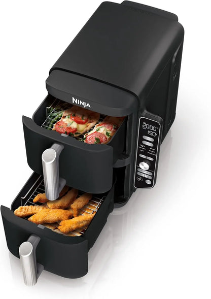 Ninja air fryer with food items inside on a white background
