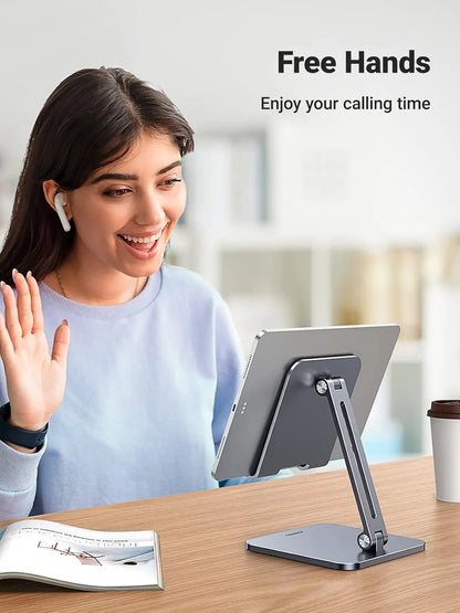 Woman using a tablet stand with text 'Free Hands Enjoy your calling time' on a blurred background