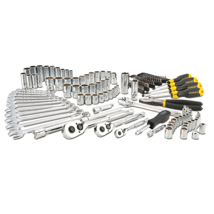 Set of tools including wrenches, sockets, and screwdrivers on a white background