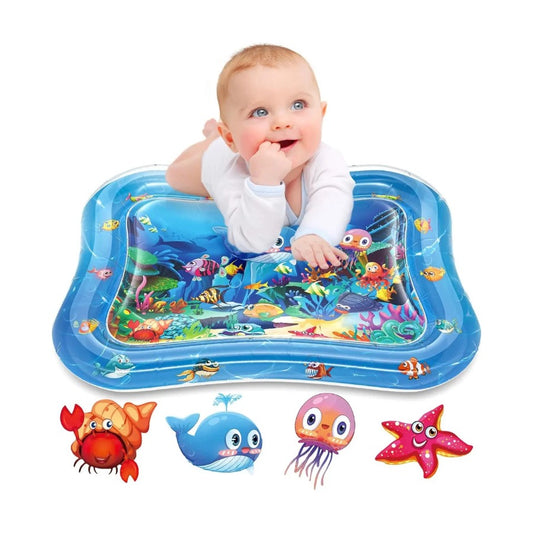 Baby playing on an inflatable water mat with ocean-themed graphics and toys.