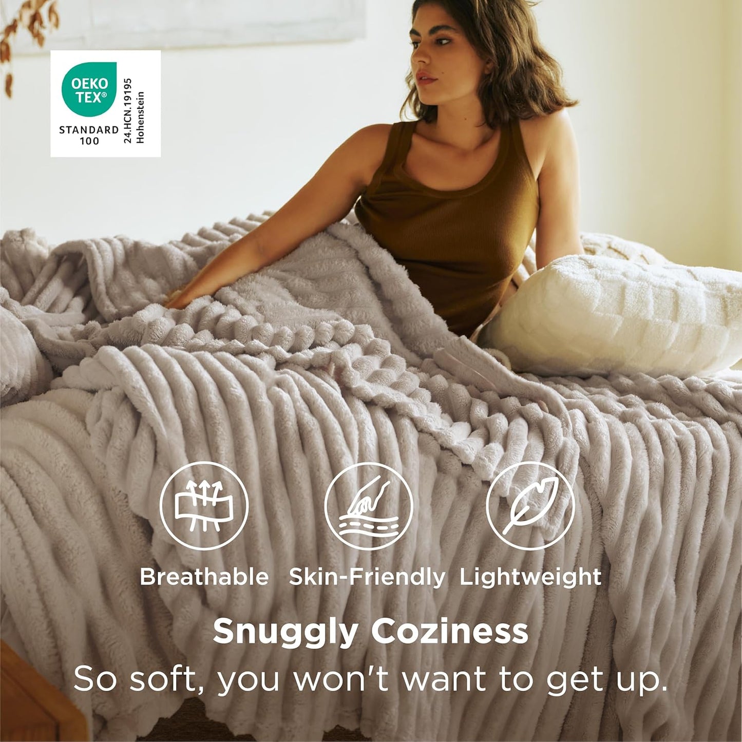 Woman sitting on a bed with a soft blanket, surrounded by text highlighting comfort features.