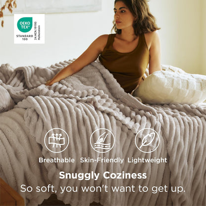 Woman sitting on a bed with a soft blanket, surrounded by text highlighting comfort features.