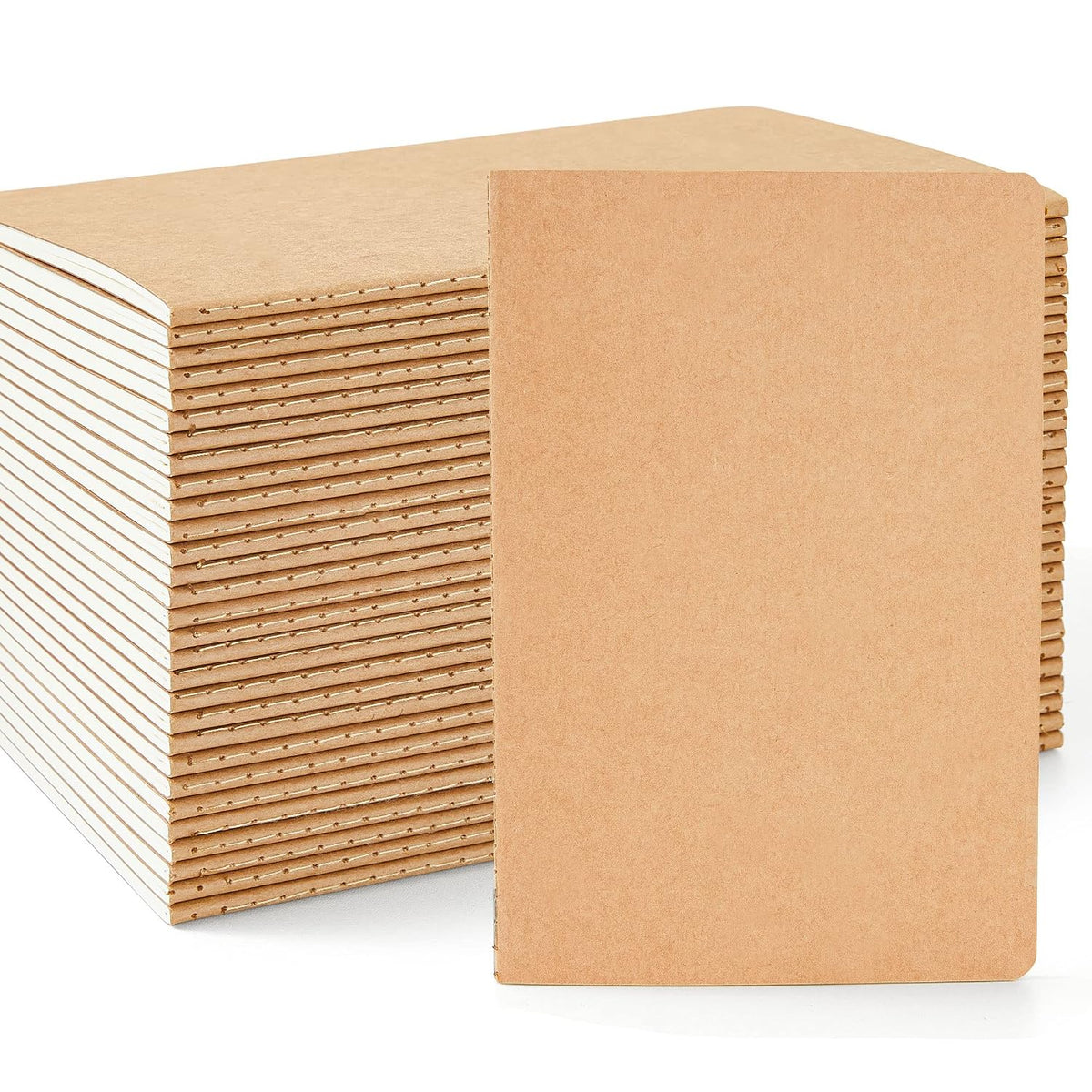 Stack of Feela A5 kraft lined notebooks showing stitched spines and brown covers