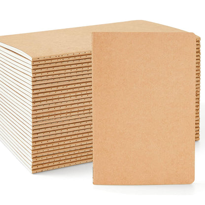 Stack of Feela A5 kraft lined notebooks showing stitched spines and brown covers