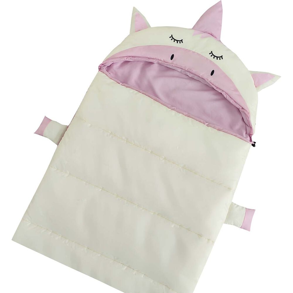 A children's puffer sleeping bag designed like a unicorn, featuring a cream-colored body, a light pink hood with embroidered closed eyes, and pink inner lining and ear tips.