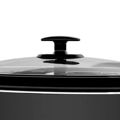 Black cookware with a glass lid on a white background