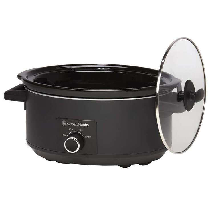 Black slow cooker with glass lid on a white background