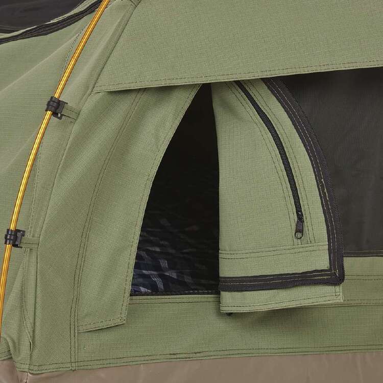 Close-up of a green camping tent with a zipper