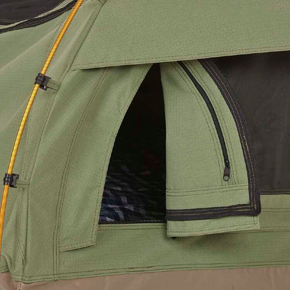 Close-up of a green camping tent with a zipper