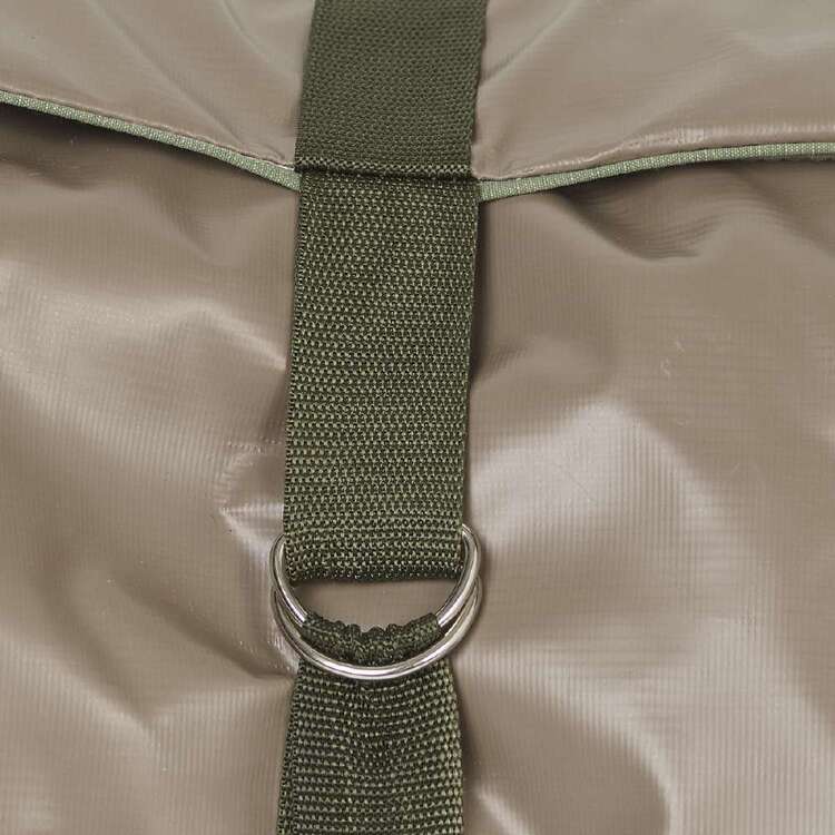 Close-up of a green strap with a metal ring on a beige fabric background