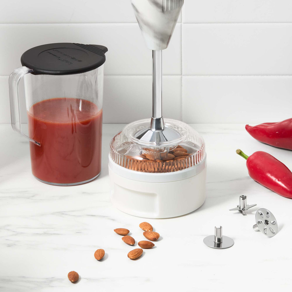 Bamix Swissline Hand Blender 200W blending shaft in wet and dry processor beside one litre jug of tomato blend