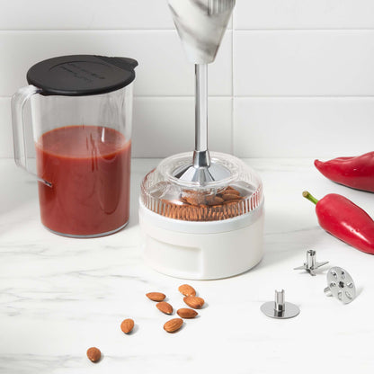 Bamix Swissline Hand Blender 200W blending shaft in wet and dry processor beside one litre jug of tomato blend