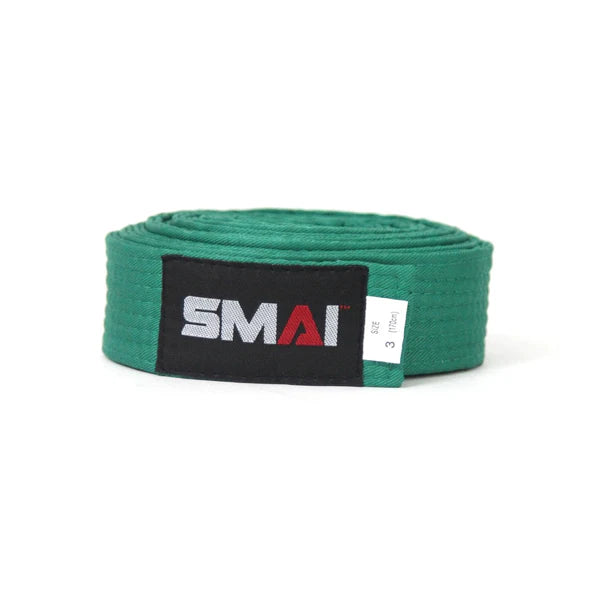 A green martial arts belt rolled up, featuring a black label with the white and red 'SMAI' logo.