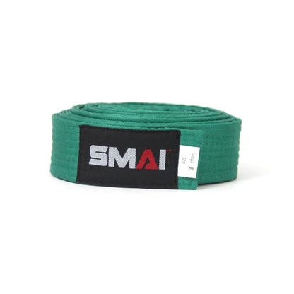 A green martial arts belt rolled up, featuring a black label with the white and red 'SMAI' logo.