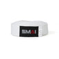 A white martial arts belt with a black label featuring the SMAI logo in gray and red, coiled on a white background.