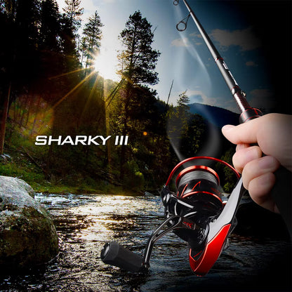 KastKing Sharky III spinning reel mounted on a rod, held streamside in a forest setting